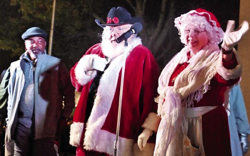 The crowd cheered as Cowboy Santa and Mrs. Claus made an appearance.