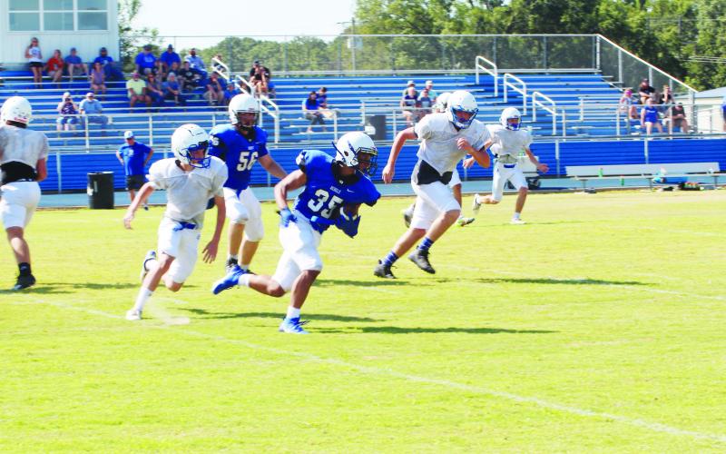 Isaiah Hunter makes a cut on what would become a touchdown run during Rivercrest’s scrimmage against Detroit at The Swamp. The Rebels scored four times in the live quarter. TRIBUNE PHOTOS / QUINTEN BOYD