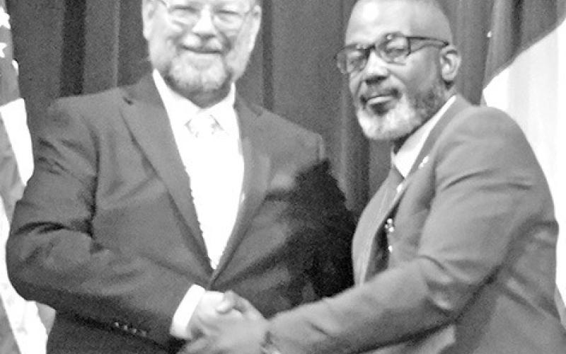 Current Mayor Tracy Craig and his opponent Wesley Lyon share a handshake after answering questions TRIBUNE PHOTOS / NICOLE KIMBALL