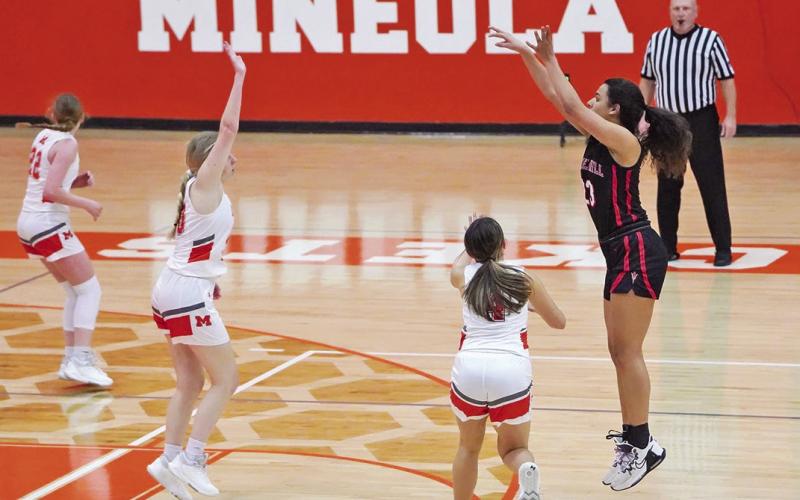 Mackenzie Espinosa puts up a three-pointer during Friday’s game at Mineola.