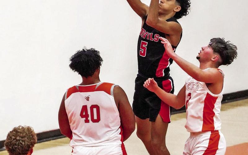 Cayden Martinez floats to the basket during Friday’s game at Mineola. COURTESY PHOTOS