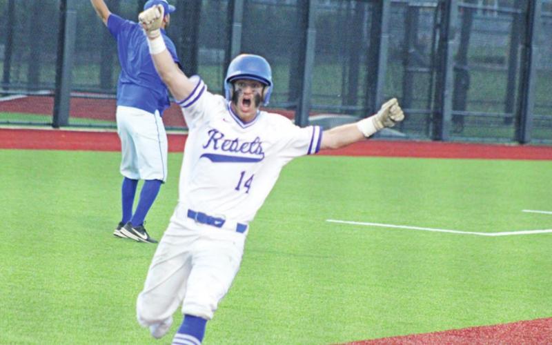 Zane Dees celebrates after scoring the first and game-winning run in Rivercrest’s 2-0 win over Kerens in game two of their area round series. TRIBUNE PHOTO / QUINTEN BOYD