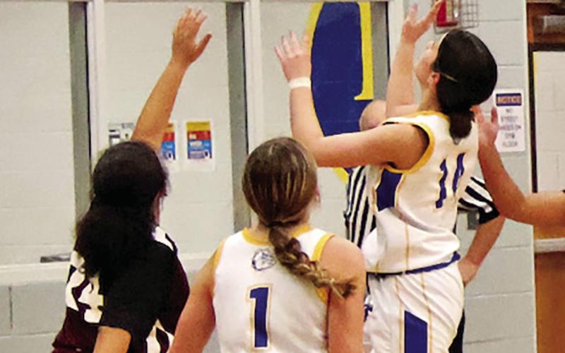 Harts Bluff’s Delainy Torres (21) puts up a shot against Maud last week in a junior high contest. COURTESY PHOTOS