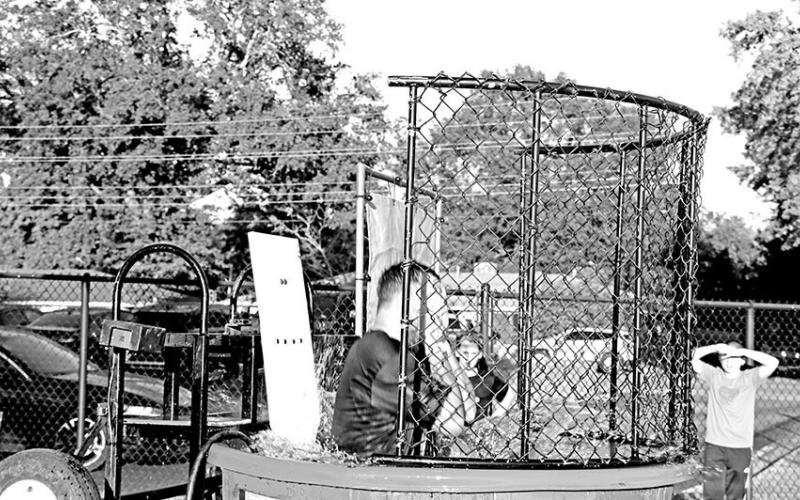 P.E.teacherJaredElliotttakeshischancesinthedunking P.E.teacherJaredElliottgetstakendown booth
