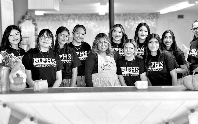 Senior Cosmetology students at Glossy Nail Lounge (L to R) Lesly Canada, Bryanna Nava, Jennifer Pena, Raquel Martinez, Glossy Nail Lounge owner Ellie Ruiz, Tania Rangel, Perla Gaytan, Vanessa Ramirez, Yoselin Lopez, Amy Carrillo, MPHS Cosmetology instructor Aleshia Rivera COURTESY PHOTOS