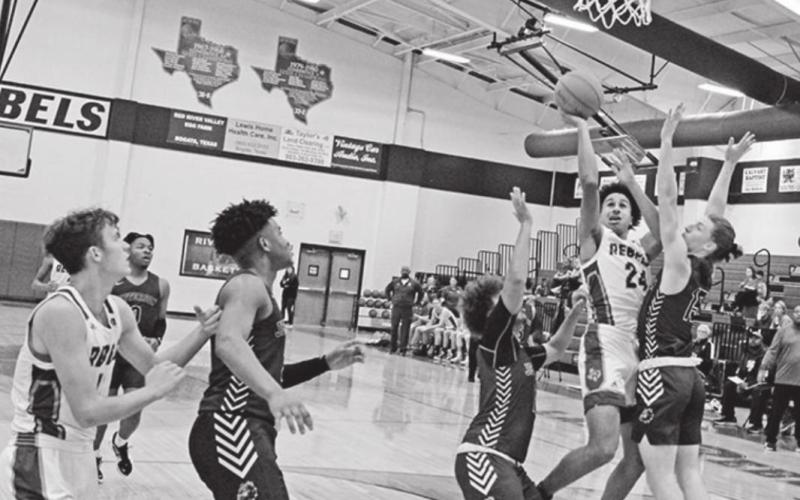 Kamryn English soars for a layup during Rivercrest’s tournament game against Jefferson. TRIBUNE PHOTO / QUINTEN BOYD