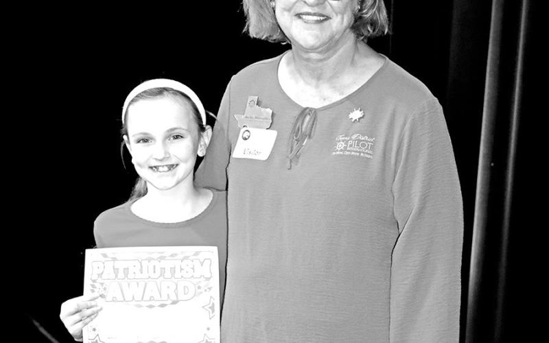 Anna Henry (left) receives her award from Pilot Club member, Becky Meriwether Courtesy Photo