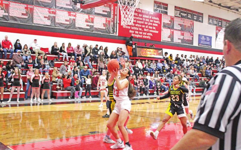 Mackenzie Espinoza battles to put up a layup during Chapel Hill’s Homecoming Game against Timpson Friday.