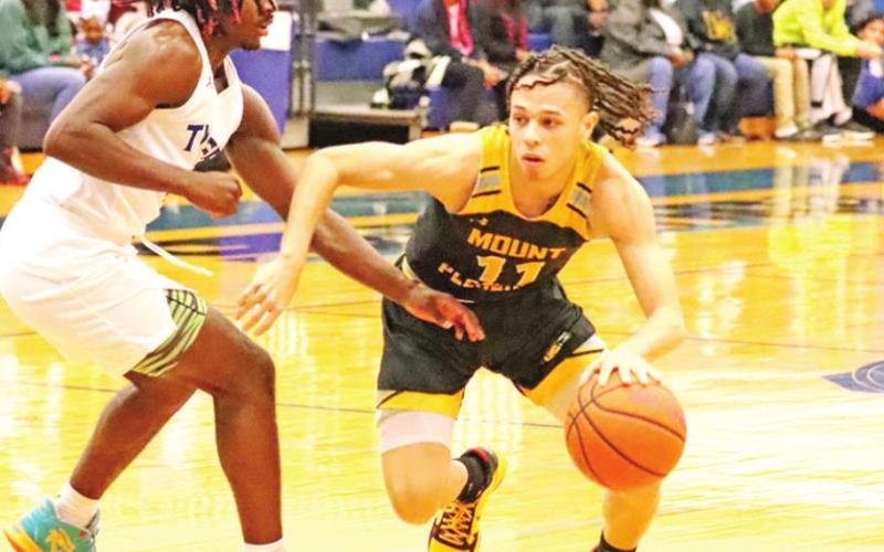 Payton Chism drives the ball against a Tyler defender. PHOTOS BY JOHN WHITTEN