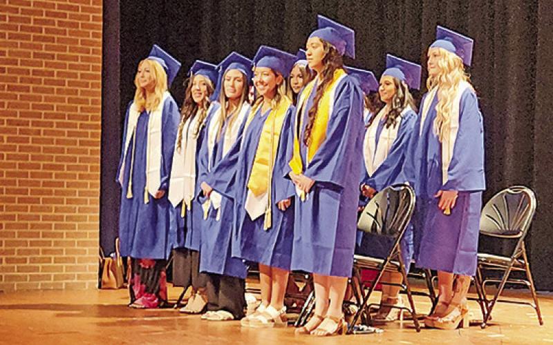 Graduates of Mount Pleasant Dental Assistant School walk the stage