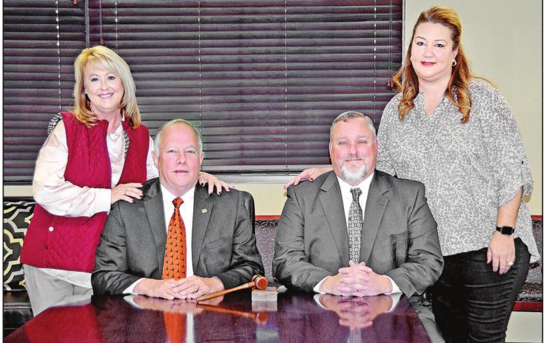 Pictured with their wives, First Federal Community Bank long time President Richard M. “Dick” Amis and Brad Meyers, a seven year employee of the Bank who has now been named President and Chief Executive Officer. Amis will continue as the bank’s Chairman of the Board. COURTESY PHOTO