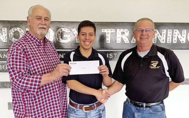 Erman Hensel, president; Christian Flores, award recipient; Tim Davis, secretary-treasurer. COURTESY PHOTO