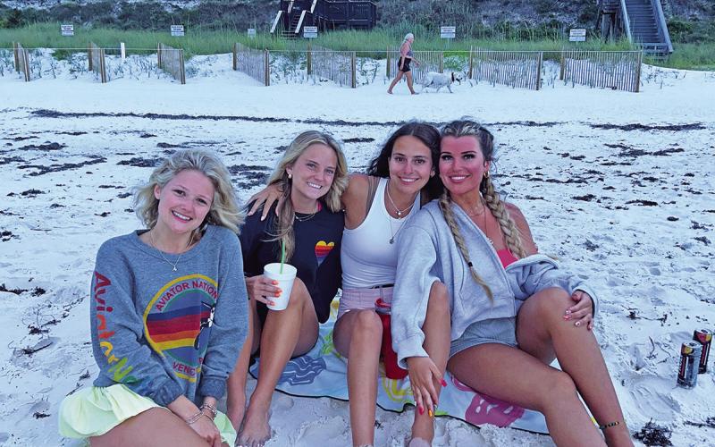 Carson, Conlee, Katy, and Ella posing together on Rosemary Beach during their senior trip (Courtesy of CARSON ZACHRY, CONLEE ZACHRY, ELLA CROSS, AND KATY MONK )