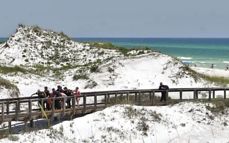 EMTs rush shark victims to helicopter (Courtesy of Walton Co Sheriff’s Office)