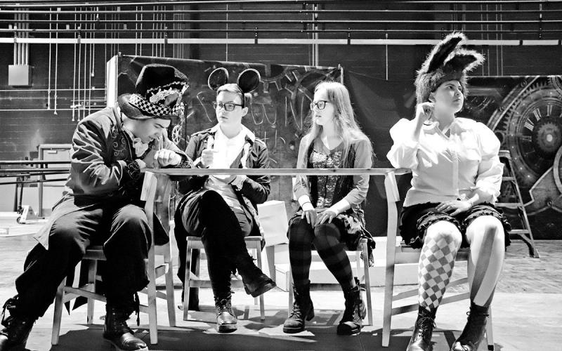 Cast members (L to R) Dawson Hernandez, Jeffrey Bond, Sadera Lampard, and Summer Murillo rehearse a scene from Alice in Wonderland COURTESY PHOTO