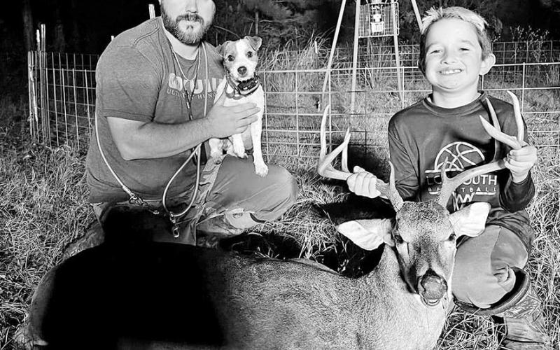 Deer tracker Jared Polasek and his Jack Russell Terrier “Scout” with the fruits of their labor. Polasek says one of worst things a hunter can do before calling in a tracking dog is grid searching the area. (Courtesy Photo, Jared Polasek)