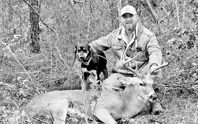 Veteran handler Jeff Glende and his hound/cur “Dago.” Glende says hunters should be observant and share all the little details about the shot with the tracker beforehand. (Courtesy Photo, Jeff Glende )