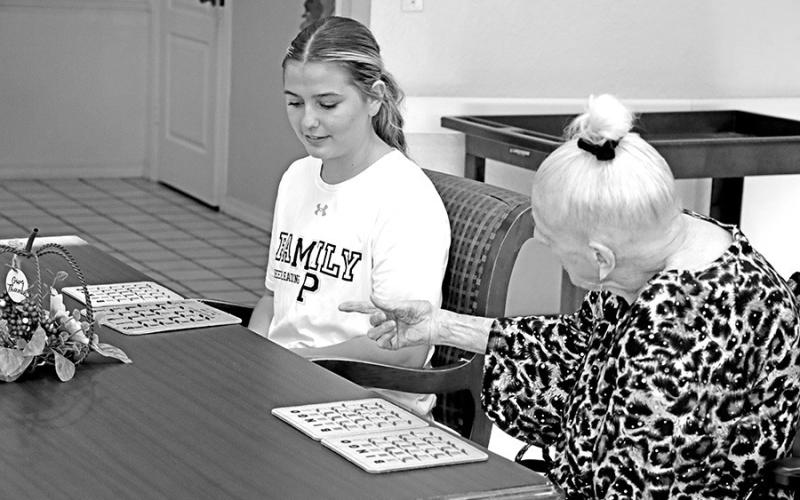 Resident Barbara Rust tells MPHS cheerleader, Adie Rosewell, to turn her card over when she wins
