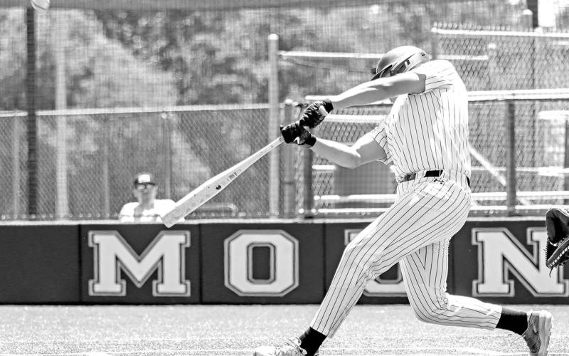 Nate Copado drives a fastball into the outfield against Melissa.