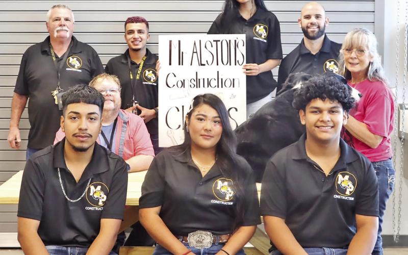 Front (L to R) Construction students Emilio Reyes, Jr., Addriana Cordova, Alan Nava. Center (L to R) MPHS Life Skills teacher James Townsend, Johnette Poole and one of her therapy dogs. Back (L to R) MPHS Construction instructors Jim Alston and Alan Salinas, MPHS Construction student Ailyen De La Rosa, MPHS Principal Craig Bailey COURTESY PHOTO
