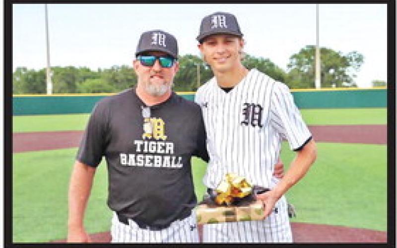 Mount Pleasant baseball Head Coach Tommy Stewart stands with Will Luck prior to the Tigers’ final home game of the season. Luck is the team’s lone senior and scored a run in Mount Pleasant’s win at Tyler Monday. COURTESY PHOTO