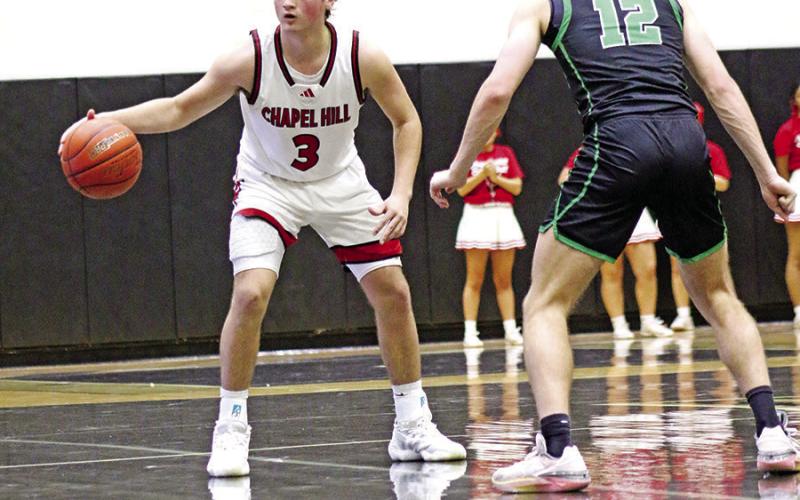 Chapel Hill’s Rhett Barley (3) dribbles down court in the regional semifinal loss to Paradise on Friday night.