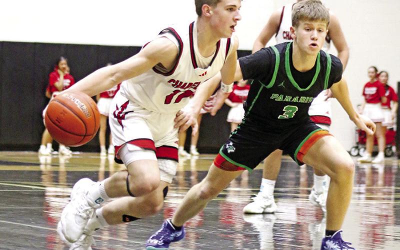 Chapel Hill’s Jace Sullivan (11) dribbles past a Paradise defender during Friday night’s regional semifinal loss in Kaufman.