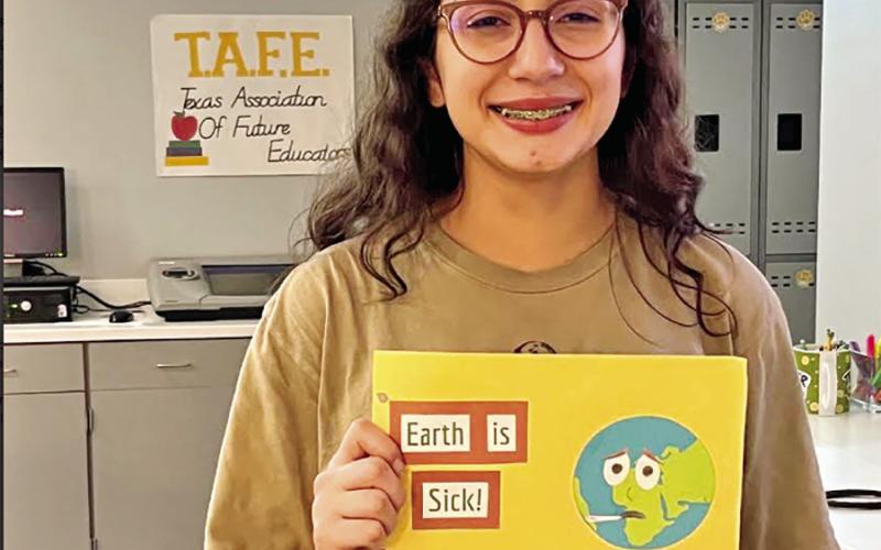 Gabby Garza with her state advancing children’s book. COURTESY PHOTOS