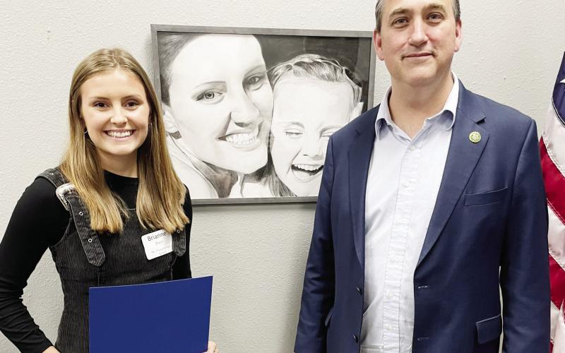 Brianne Davis with her Honorable Mention award and Congressman Nathaniel Moran. COURTESY PHOTO