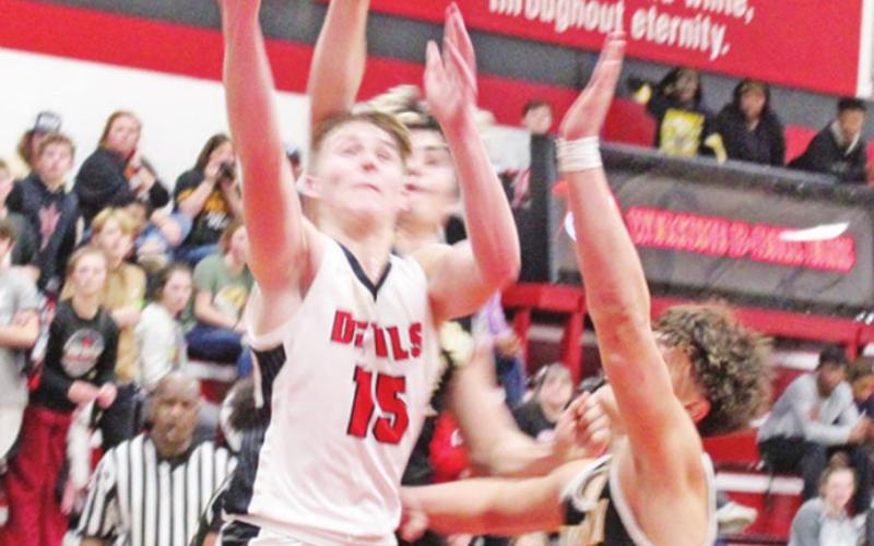Braden Buchanan drives through the defense to attempt a layup during a recent game. TRIBUNE PHOTO / QUINTEN BOYD