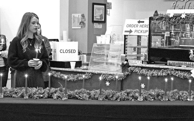 13 candles were lit in memory of TRMC members who passed away in 2025.