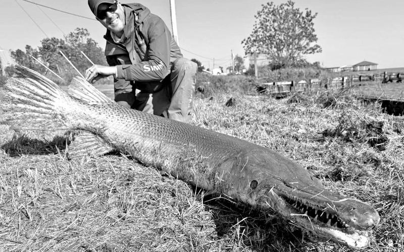 Light line specialist Art Weston with the 153 pound alligator gar he landed on April 8 at Lake Livingston. Caught on 2 pound test line, Weston’s catch is a pending line class record and the heaviest freshwater fish ever landed worldwide using 2 pound line. (Courtesy Photo Art Weston)