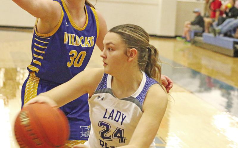 Rivercrest’s Macy Childres makes a pass during a recent game. The Lady Rebels won their district opener at Detroit, 56-41. Rivercrest traveled to Maud Tuesday and will host James Bowie Friday. TRIBUNE PHOTO / QUINTEN BOYD