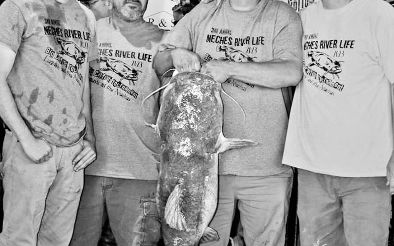 Hunter Kaemmerling, Shawn Kaemerrling and Brent Cotton won the $8,000 pot for catching the heaviest cat in the 3rd Annual Neches River Life Big Catfish tournament held April 14-15 on the Neches River. The flathead weighed 49.8 pounds. COURTESY PHOTO / SHELBY M. PHOTOGRAPHY