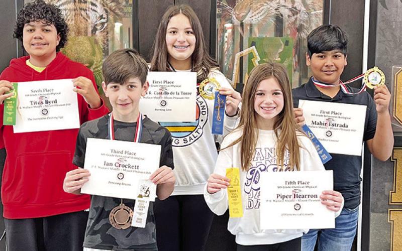 Wallace Middle School Region 8 Science Fair award winners. Front row (L to R) Ian Crockett and Piper Hearron. Back row (L to R) Titus Byrd, Maria R. Castillo de la Torre, and Mahir Estrada COURTESY PHOTOS