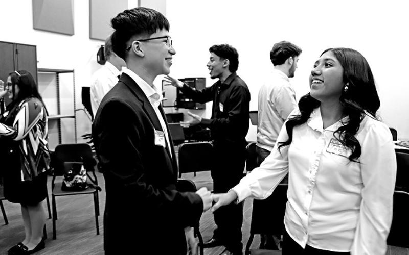 MPHS FBLA members Erick Bernardi (left) and Irlanda Gasca play an ice breaker game trying not to be the first one to laugh