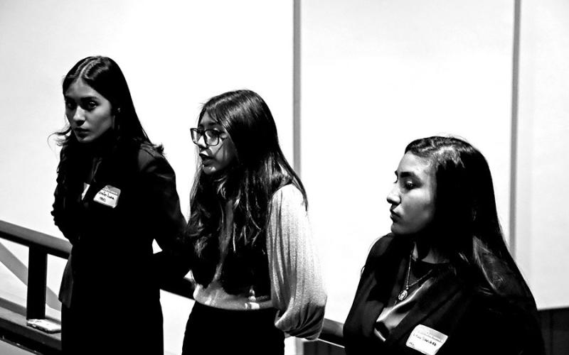 MPHS FBLA members (L to R) Jennifer Luna, Brissia Alvarez, and Xitlaly Sanchez speak to FBLA Middle Level members from Wallace Middle School and Mount Pleasant Junior High