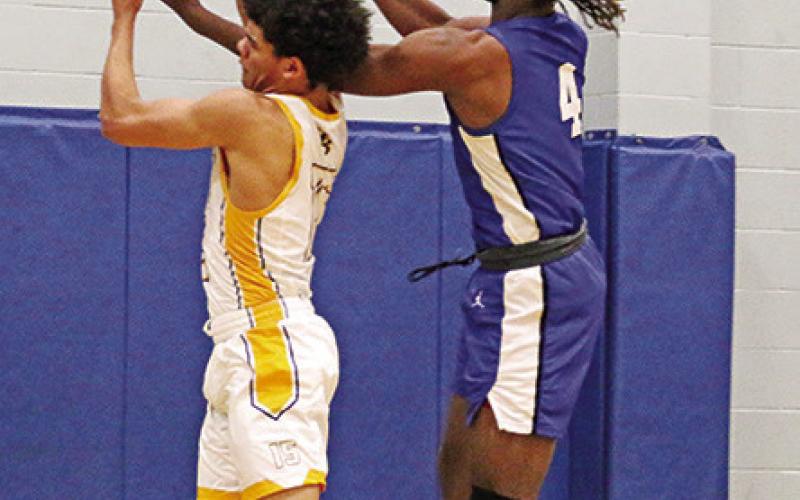 Harts Bluff’s Cayden James battles with Clarksville’s Jayden Reed-Rose for a rebound during Thursday’s game. The Bulldogs fell by one against Clarksville and by eight at Rivercrest in their last two games. TRIBUNE PHOTOS / QUINTEN BOYD
