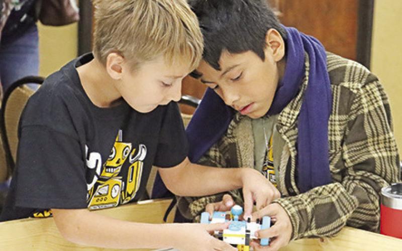 The Robotic Warriors make some final adjustments before their match starts.