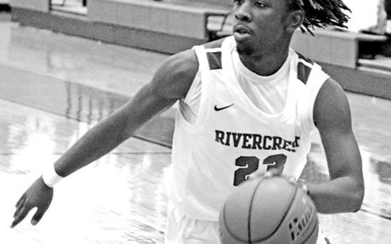 Rivercrest’s Cameron Lowe drives toward the basket. The Rebels rolled past Detroit Tuesday, 85-16. TRIBUNE PHOTOS / QUINTEN BOYD