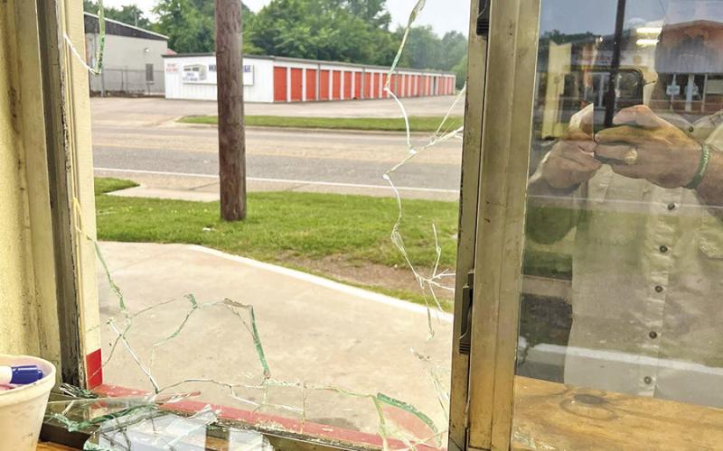 A window at the drive-thru of MP Burgers &amp;amp; Fries broken during a robbery COURTESY PHOTO / MP BURGERS AND FRIES