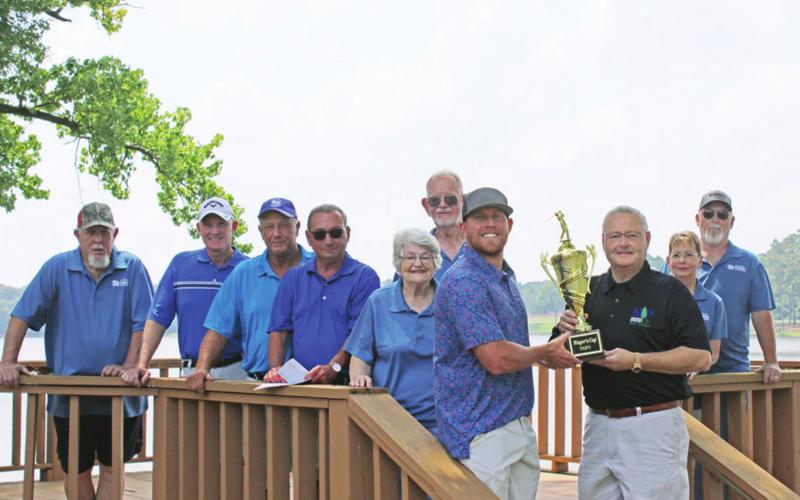 Mayor Pro Tem Tim Dale presents the Tredit Tire team with the 2021 Mayor’s Cup. TRIBUNE PHOTO / DI DUNCAN