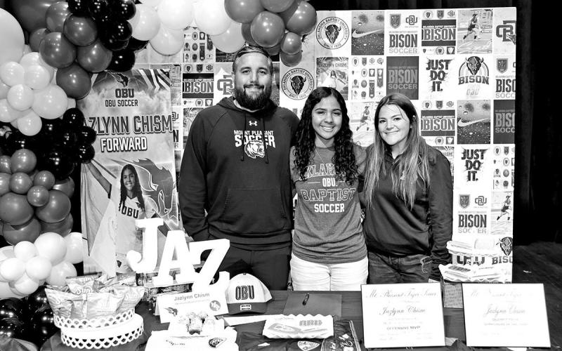 Jazlynn Chism with MPHS soccer coaches David Zaldivar (left) and Krissa Woods