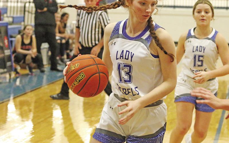 Abigail Scott brings the ball up the floor while teammate Logan Huddleston trails the play. The Rivercrest Lady Rebels sit in first place after the first round of district play.