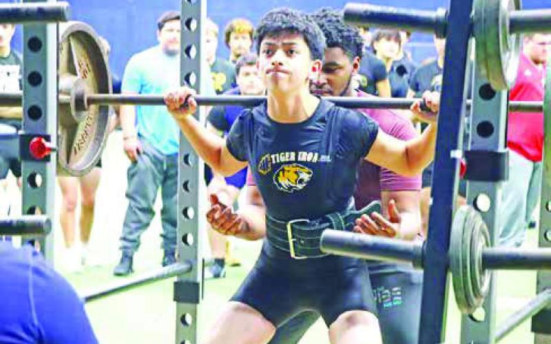 Sophomore Isaac Hernandez prepares for his squat attempt. Hernandez medaled in 5th place overall.