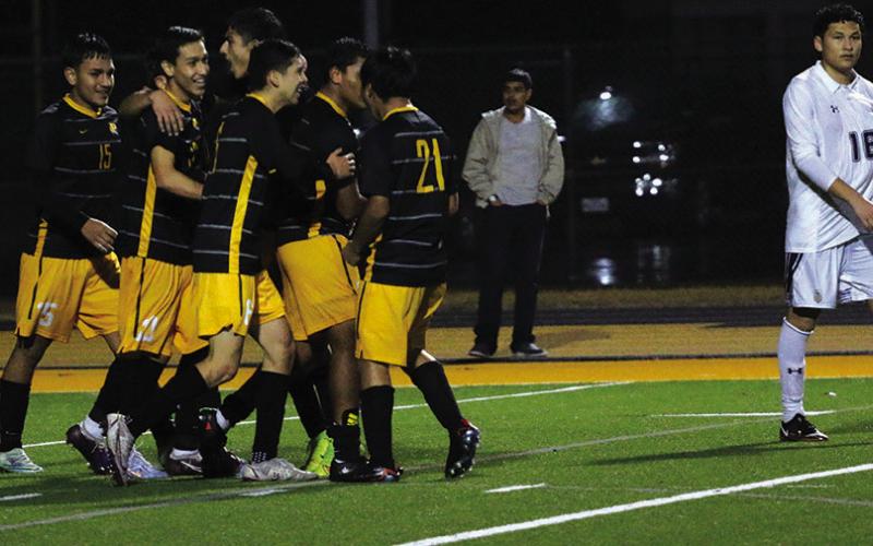 The Mount Pleasant Tigers celebrate after John Zelaya’s goal that would be the game winner in their matchup with Pine Tree. PHOTO BY QUINTEN BOYD