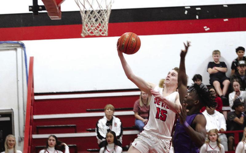 Braden Buchanan soars to the basket. The Chapel Hill Red Devils concluded their district slate Tuesday at Quitman. PHOTO BY QUINTEN BOYD