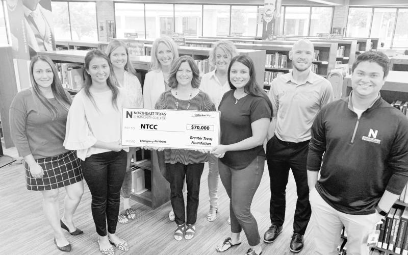 Pictured receiving the first $70,000 installment of the Texas Emergency Aid Roadmap Grant on behalf of NTCC is (from left) Erika Garza, Susy Perez, Billi Jo Thomas, Kim Irvin, Nita May, Anna Ingram, Jessica Dorantes, Jeff Chambers and Mason May. COURTESY PHOTO