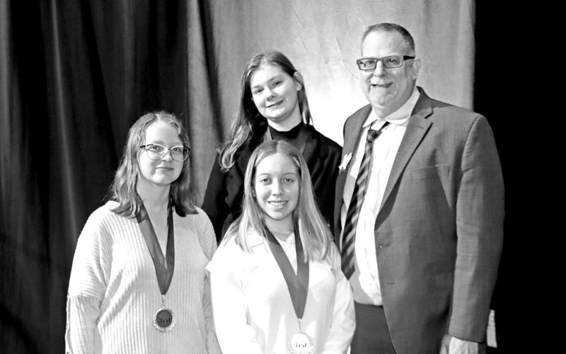 Computer Game and Simulation Programming National qualifiers (L to R) Charity Prater, Aloani Laboy, Isabella Furnish, and FBLA Advisor John Whitten