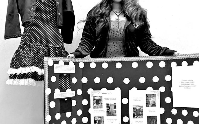 Dayanara Pulquero with the garments she created in Fashion Construction